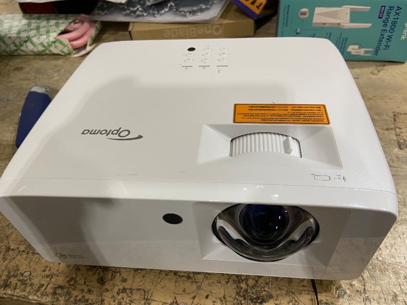 Photo 1 of **FOR PARTS, ITEM TURNS ON BUT DOES NOT FUNCTION**
Optoma UHZ35 High Brightness 4K UHD HDR Home Theater and Gaming Laser Projector