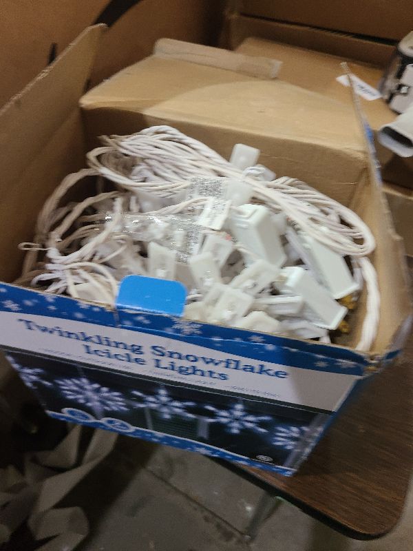 Photo 1 of 2 Pack Twinkling LED Christmas Snowflake Lights with 6 Drops, 8.8FT 14 of 100 Random Twinkle Christmas Snowflake String Lights, Connectable Hanging Plug in Icicle Light for House Roof (Cool White)