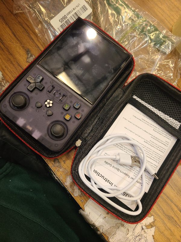 Photo 1 of R36MAX Retro Handheld Games Console, Retro Game Console with 4.0 inch IPS HD Screen, Video Game Consoles with 64GB Memory, Portable Gaming Player for Travel, Gift for Teen or Partner, Gray