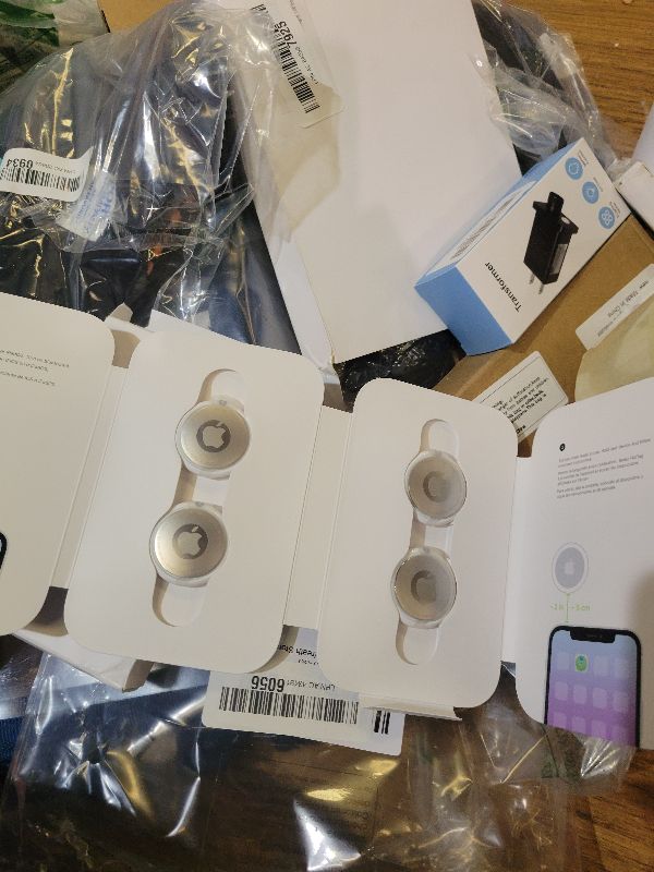 View 2 of Apple AirTag 4 Pack. Keep Track of and find Your Keys, Wallet, Luggage, Backpack, and More. Simple one-tap Set up with iPhone or iPad