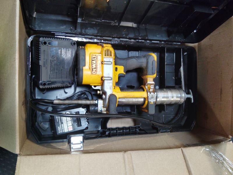 Photo 1 of ***USED***DEWALT Grease Gun Kit 20V MAX with 4.0Ah Battery and Charger, Cordless Grease Gun, LED Light, 42” Hose, 10,000 PSI, Variable Speed Triggers (DCGG571M1)