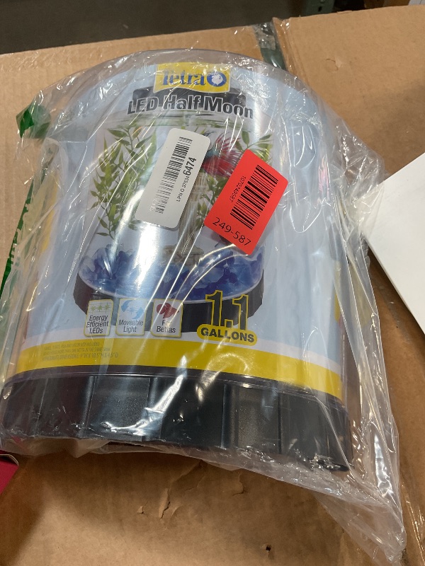 Photo 1 of **FOR PARTS/ DAMAGED** Tetra LED Half Moon Aquarium Kit, 1.1 Gallons, Small, Clear Plastic Fish Tank With Curved Front, Easy Feeding And Movable, Energy-Efficient LEDs Ideal For Bettas Great As Desk Aquarium