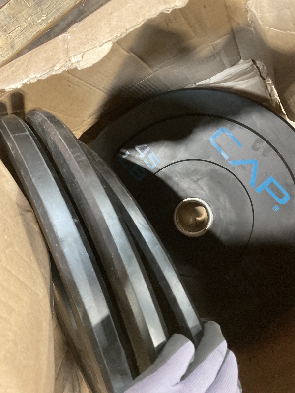 Photo 1 of ** SELLING AS PARTIAL SET. ONE PAIR OF 10 . A SINGLE 15 A SINGLE 45.**CAP Barbell 100 LB Economy Olympic Bumper Plate Set with Color Logo | Black