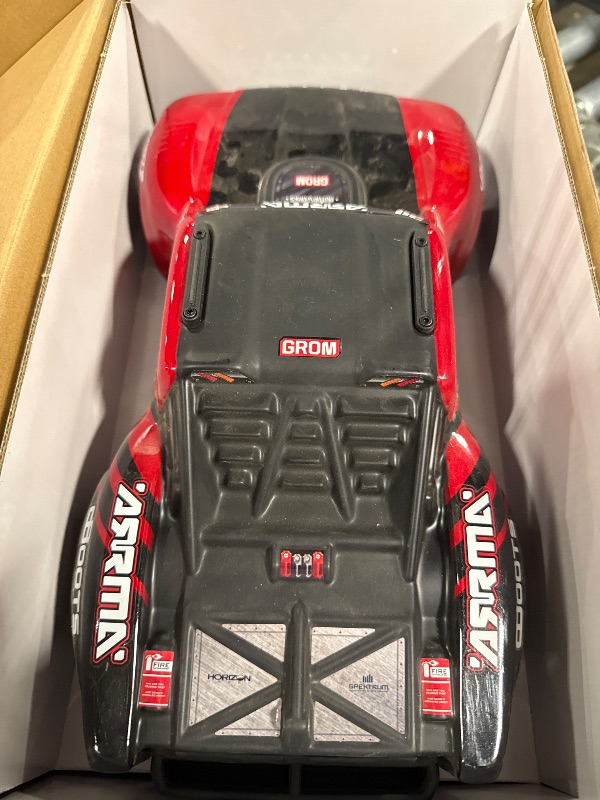 Photo 1 of ** UNKNOWN FUNCTIONALITY **ARRMA RC Truck Mojave GROM 4x4 Smart Small Scale Desert Truck, RTR (with Battery and Charger Included) Red/Black ARA2104T1