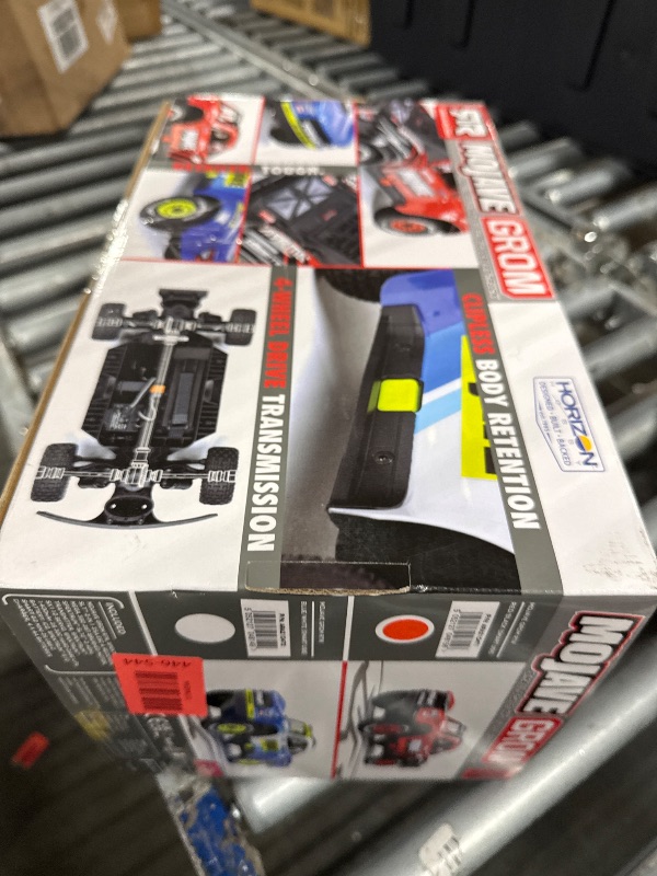 Photo 1 of ** UNKNOWN FUNCTIONALITY **ARRMA RC Truck Mojave GROM 4x4 Smart Small Scale Desert Truck, RTR (with Battery and Charger Included) Red/Black ARA2104T1