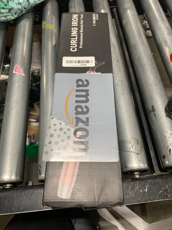 Photo 1 of 1 1/4 Inch Tourmaline Ceramic Curling Iron with LCD Display, Dual Voltage for Long Hair, Includes Glove, Comb, Clips and Pad