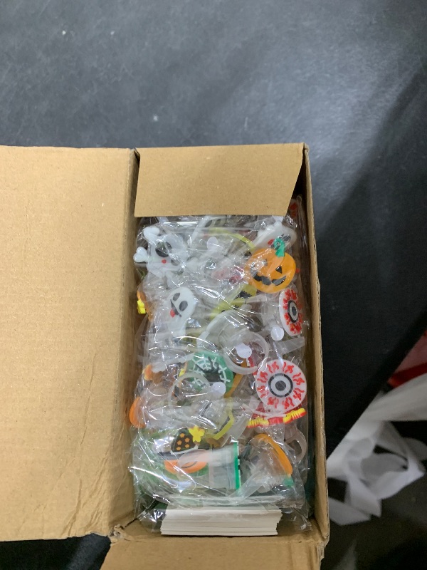 Photo 1 of 100 PCS Halloween Party Favors for Kids, Halloween Glow in the Dark Toys Rotating Spin Light Up Necklaces, LED Rings Bracelets Balls Decorations, Halloween Trick or Treats Classroom Goodie Bag Fillers