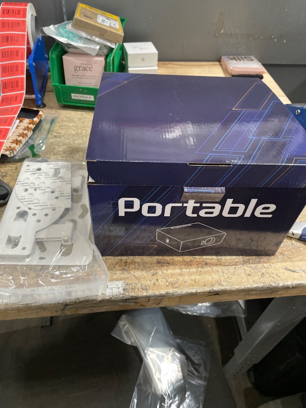 Photo 1 of [1800 ANSI & Auto Focus] Smart Mini Projector with WiFi 6 and Bluetooth, 4K Support Outdoor Movie Projector, Native 1080P Dolby Audio Portable Projector for Bedroom/Home/Celling