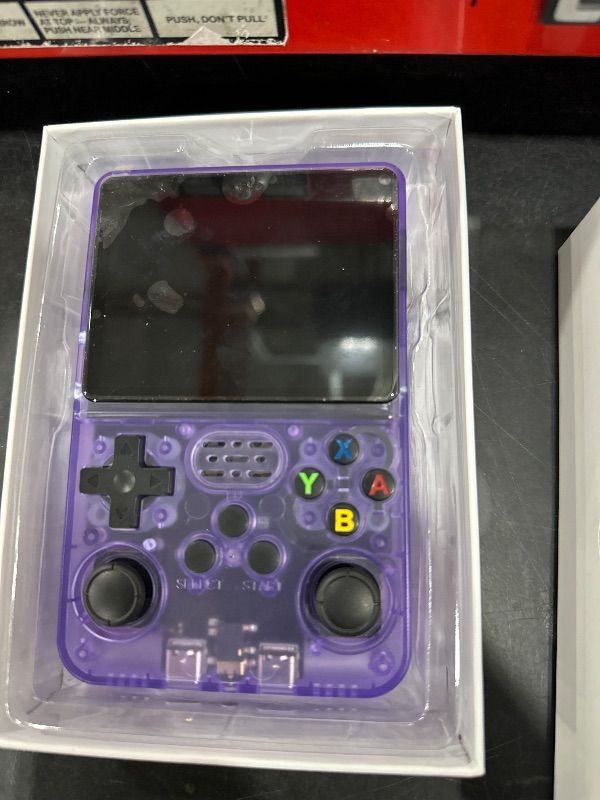 Photo 1 of ** FOR PARTS ONLY ** 
R40S PRO Retro Gaming Console, 30000+ HD Games Handheld Game Console, 3800mAh Rechargeable Mini Retro Video Console with 256GB TF Card, Portable Pocket Arcade (Transparent Purple)