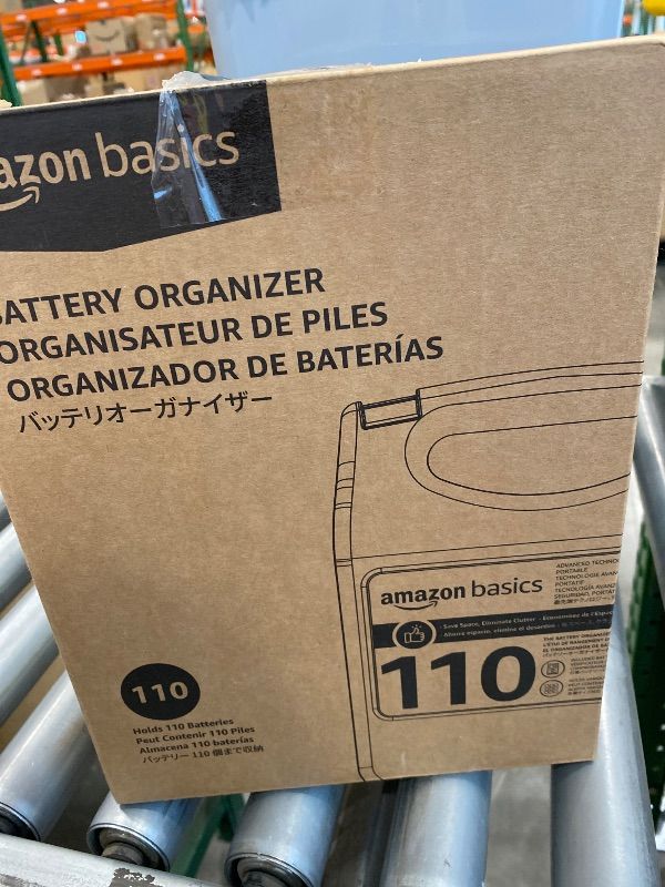Photo 1 of *USED*
Amazon Basics Battery Organizer with Tester, Wall-Mounted Design, Handle Holds 110 Batteries, Clear/Black