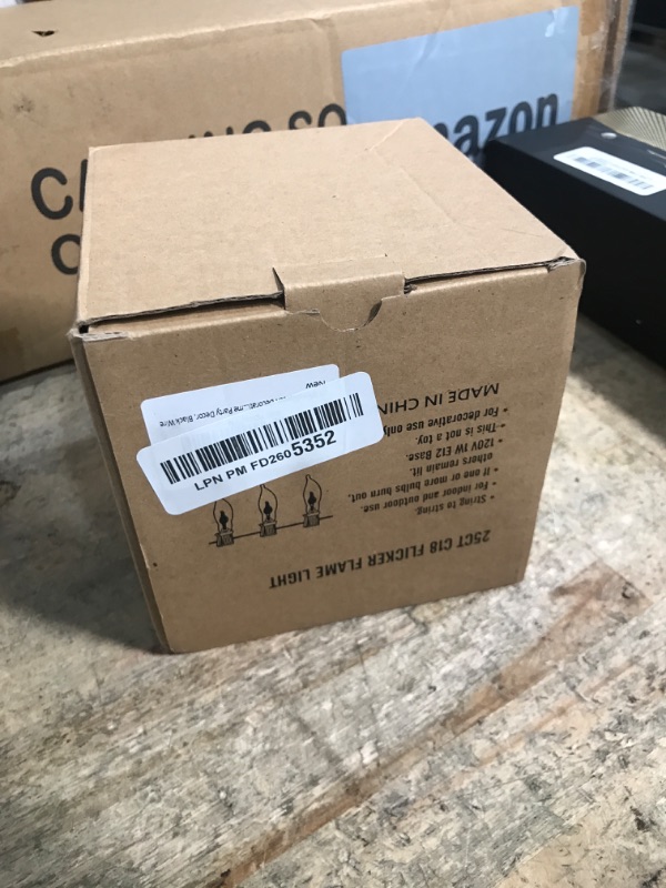 Photo 1 of 27.8Ft Halloween Decorations Flickering Flame String Lights with 29 Pack Clear Glass Flame Light Bulbs (4 Spare), E12 Base, Great for Christmas Halloween Indoor Outdoor Home Party Decor, Black Wire