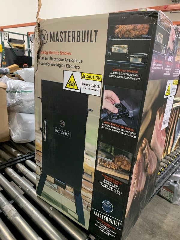 Photo 1 of Masterbuilt® 30-inch Digital Electric Vertical BBQ Smoker with Leg Kit, Side Wood Chip Loader and 710 Cooking Square Inches in Black, Model MB20070421