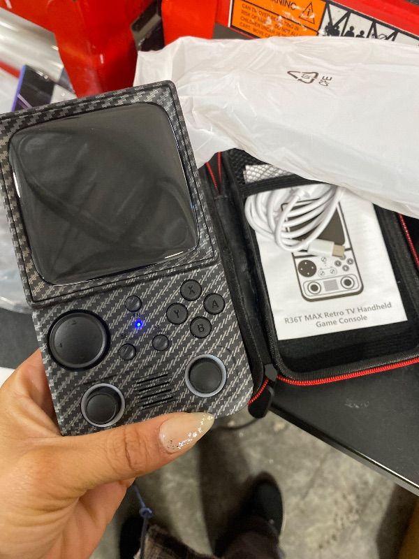 Photo 1 of MISSING SD ----------------------------------------------------R36T MAX Upgraded Retro Handheld Game Console with 4000mAh Battery, 4.0'' IPS Screen, Retro Gaming Console with Portable Case, Supports WiFi Networked Fighting and OTG(Wood Grain Black)