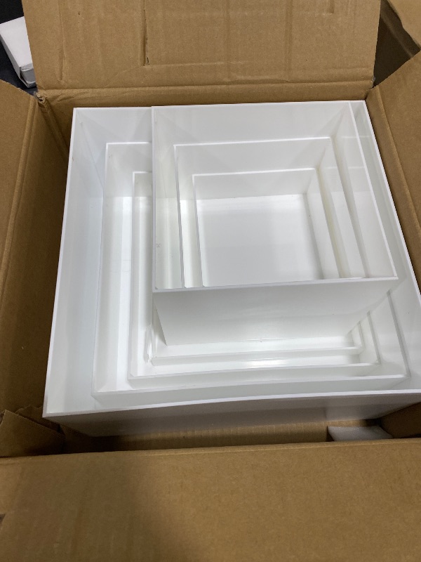 Photo 1 of Leinuosen 7 Pcs Large Buffet Risers Set 6" to 12" Acrylic Display Box Catering Dessert Table Riser Food Display Decorative Stand with Hollow Bottom for Catering Supplies(White, Square)