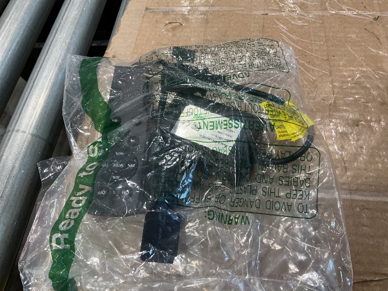 Photo 1 of  appears to show a product accessory or component, possibly a power cable or control unit, packaged in plastic.
