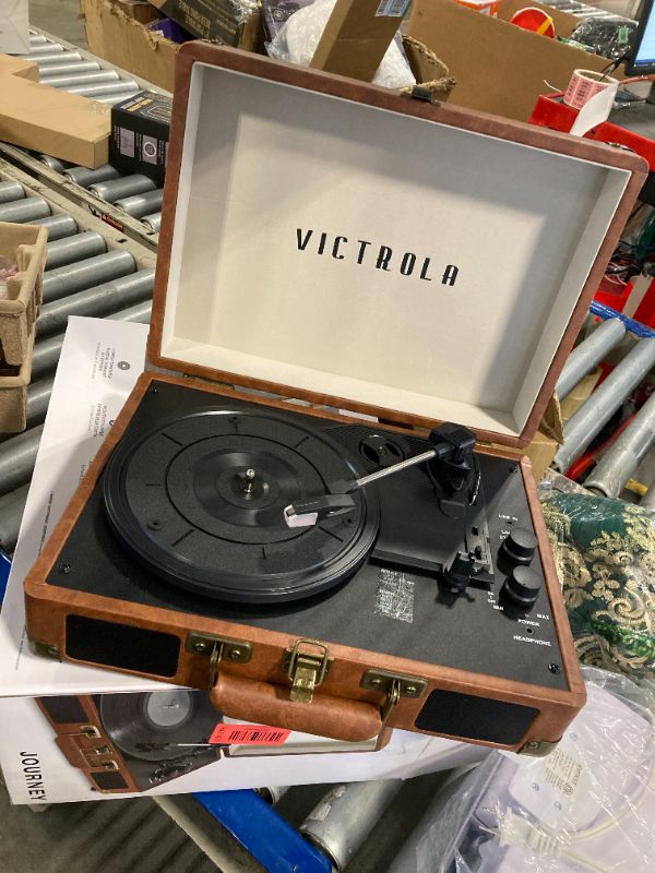 Photo 1 of *Untested*
Victrola Journey Bluetooth Portable Suitcase Record Player – with Built-in Speakers, 3 Speed Vinyl Record Player, RCA Out, Headphone Jack (Brown)