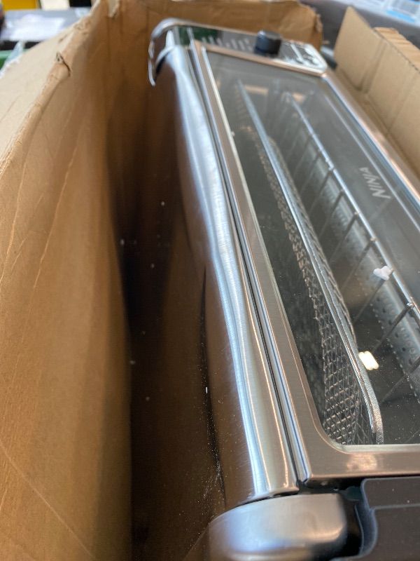 Photo 1 of [DENTED] [MAJOR DAMAGE!!] Ninja Digital Air Fryer & Toaster Oven | 8-in-1 Functionality | Flip-Up Design | XL Capacity | Air Fry Basket, Sheet Pan, Wire Rack & Crumb Tray | 1800 Watt | Silver | SP101