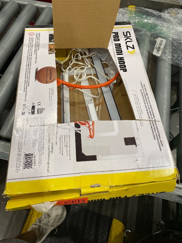 Photo 1 of [DAMAGED] SKLZ Pro Mini Basketball Hoop - 18" x 12" Clear, Shatterproof Backboard, Breakaway Rim, Heavy Duty Net, & 5" Ball - Easy Mount Padded, Slide-On Over-Door Mounts - Suitable for Office, Dorm, Bedroom
