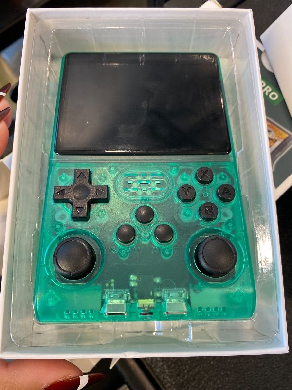 Photo 1 of ***MISSING SD CARD*** *UNTESTED*
R40S Retro Game Console - 3.5 Inch IPS Screen, 256G Extra Large Memory, Portable Pocket Video Player, Linux System, Travel Essentials, Perfect for Halloween (Transparent Green 256G)