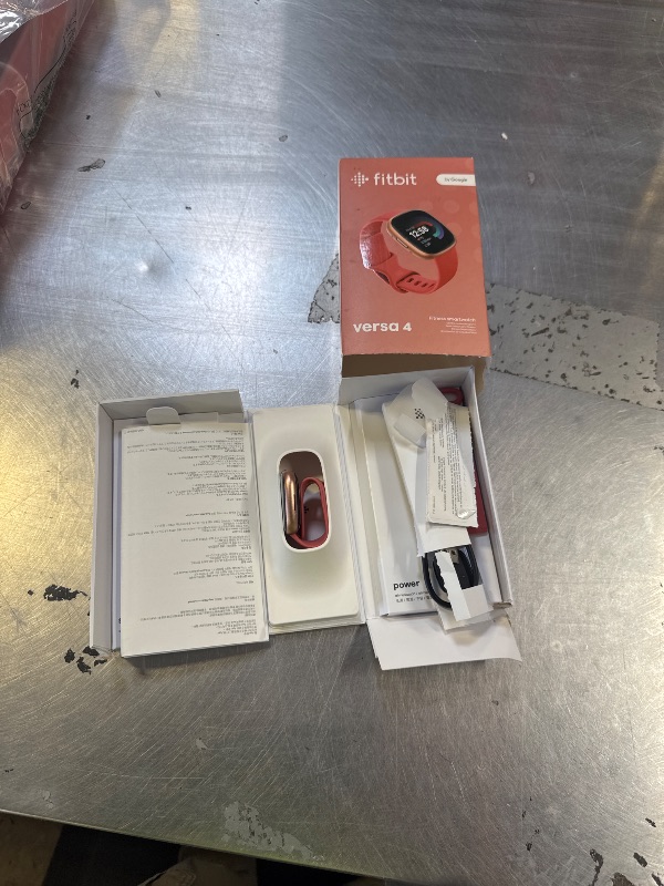 Photo 1 of Fitbit Versa 4 Fitness Smartwatch with Daily Readiness, GPS, 24/7 Heart Rate, 40+ Exercise Modes, Sleep Tracking and more, Pink Sand/Copper Rose, One Size (S & L Bands Included)