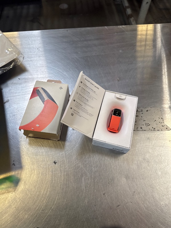 Photo 1 of Fitbit Charge 6 Fitness Tracker with Google apps, Heart Rate on Exercise Equipment, 6-Months Premium Membership Included, GPS, Health Tools and More, Gold/Coral, One Size (S & L Bands Included)