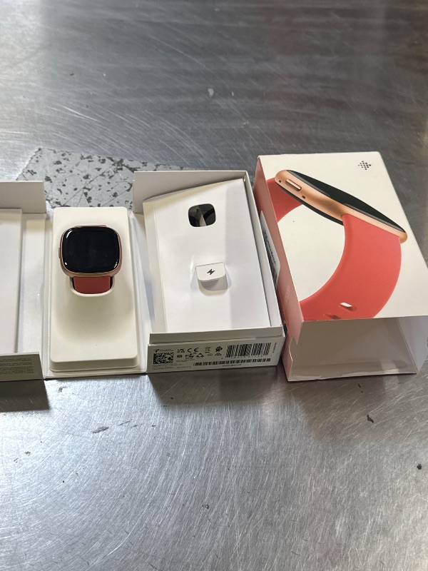 Photo 1 of Fitbit Versa 4 Fitness Smartwatch with Daily Readiness, GPS, 24/7 Heart Rate, 40+ Exercise Modes, Sleep Tracking and more, Pink Sand/Copper Rose, One Size (S & L Bands Included)