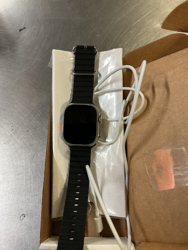 Photo 1 of Apple Watch Ultra [GPS + Cellular 49mm] Titanium Case with Midnight Ocean Band, One Size (Renewed)