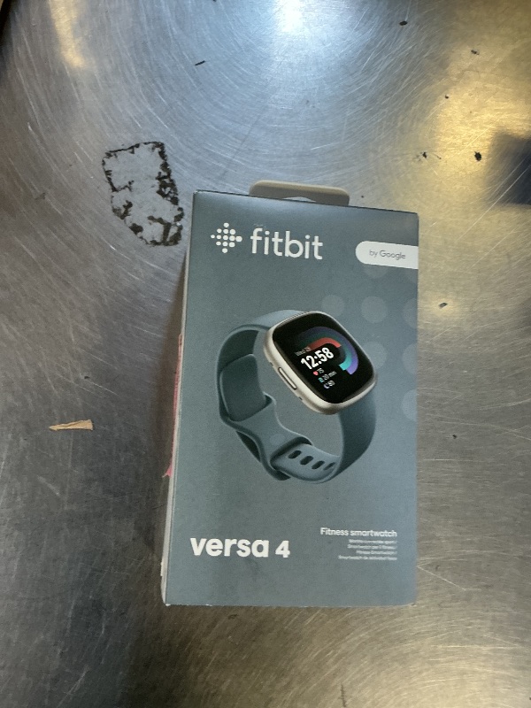 Photo 1 of Fitbit Versa 4 Fitness Smartwatch with Daily Readiness, GPS, 24/7 Heart Rate, 40+ Exercise Modes, Sleep Tracking and more, Waterfall Blue/Platinum, One Size (S & L Bands Included)
