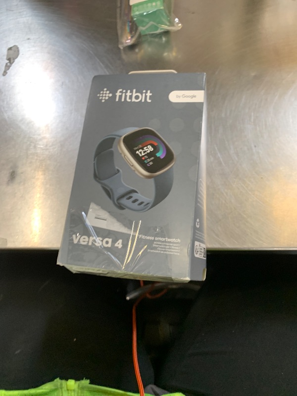 Photo 1 of Fitbit Versa 4 Fitness Smartwatch with Daily Readiness, GPS, 24/7 Heart Rate, 40+ Exercise Modes, Sleep Tracking and more, Waterfall Blue/Platinum, One Size (S & L Bands Included)