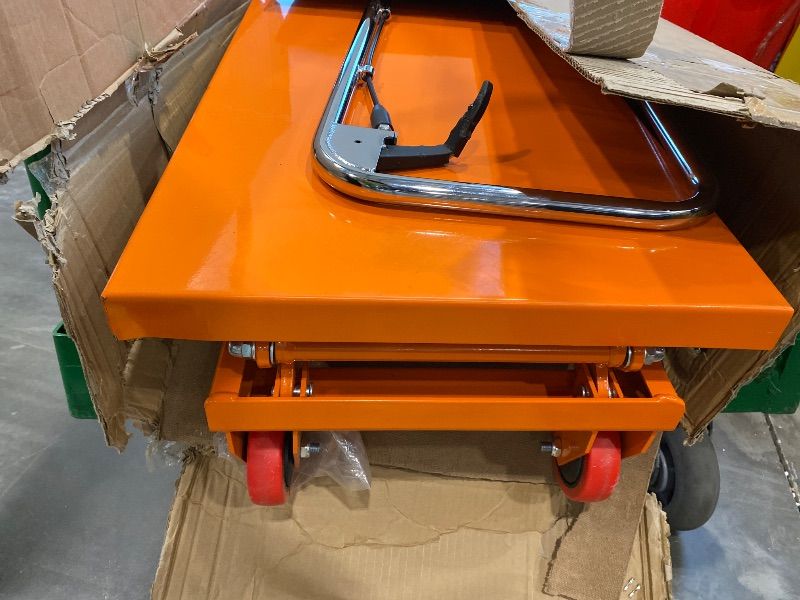 Photo 1 of **UNTESTED**
VEVOR Hydraulic Lift Table Cart, 330 lbs Load Capacity, 50-Inch Lifting Height, Manual Single Scissor Lift Table with Non-Slip Pad and 4 Wheels, Orange, Alloy Steel