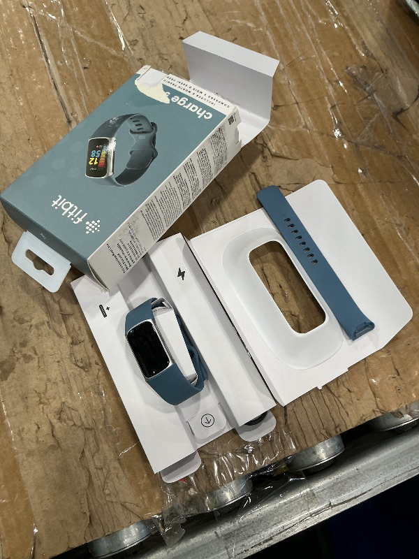 Photo 1 of ***NOT TURNING ON*** Fitbit Charge 5 Advanced Fitness Tracker with GPS, Heart Rate, Sleep & Health Tracker - Power Bundle with Adapter (Blue Stainless Steel)