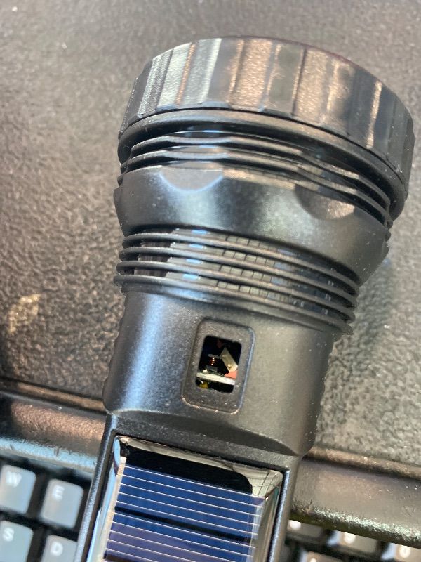 Photo 1 of ***POWER BUTTON MISSING*** E-SHIDAI Solar Rechargeable Flashlight, Multi Function 1000 Lumens LED Flashlight with Emergency Strobe Light, Handheld LED Flashlights for Home Emergencies Camping