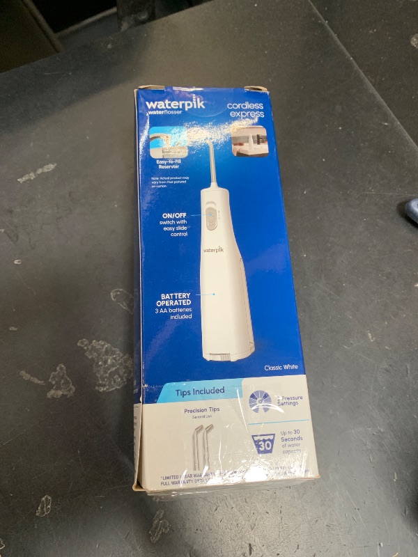Photo 1 of Waterpik Cordless Express Water Flosser, Battery Operated & Portable for Travel & Home, ADA Accepted, Waterproof for Shower Use, White WF-02, Packaging May Vary