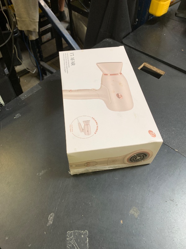 Photo 1 of T3 Afar Lightweight Travel-Size Hair Dryer with Auto Dual Voltage, Folding Handle, Fast Drying, Lightweight and Ergonomic, Frizz Smoothing, Multiple Heat and Speed Combinations