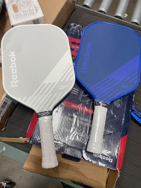 Photo 1 of ****SEE NOTES***Reebok - Pickleball Set for 2 Players, Fiberglass Power Paddles with 13mm Polypropylene Core, Comfort Grip Handles, Aero Flight Balls, Ideal for Sports and Enthusiasts