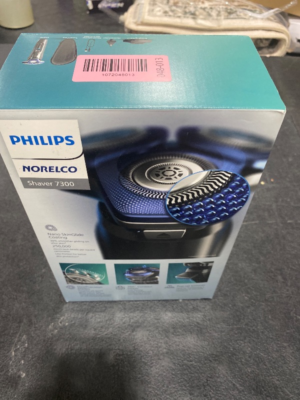 Photo 1 of Philips Norelco Shaver 7300, Rechargeable Wet & Dry Electric Shaver with SenseIQ Technology, Pop-up Trimmer, Charging Stand, Click-on Nose Trimmer, & Travel Case, S7887/92