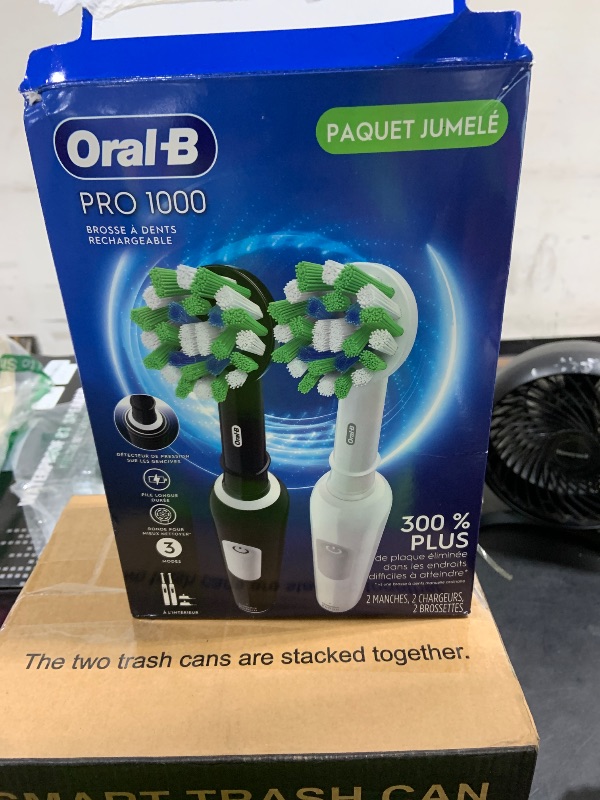 Photo 1 of Oral-B Pro 1000 CrossAction Electric Toothbrush, Black and White, 2 Count