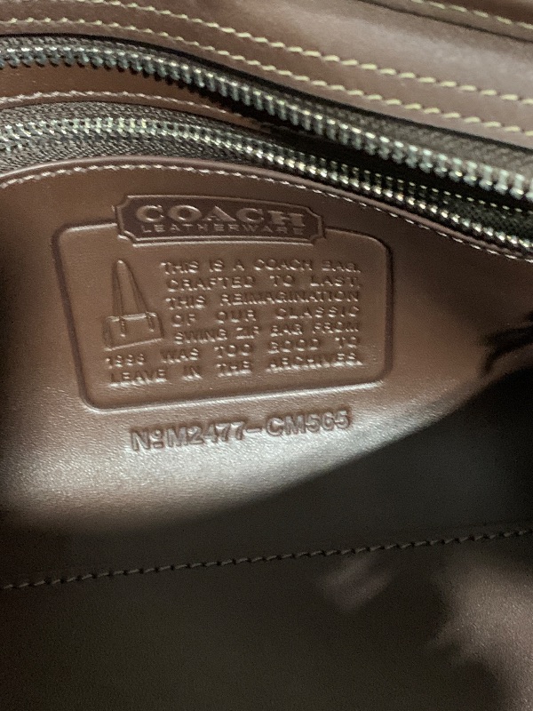 Photo 1 of COACH Women's Swing Zip Bag, LH/Maple, One Size