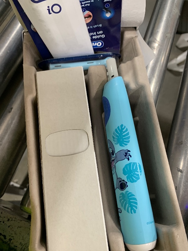 Photo 1 of Oral-B iO Kids Rechargeable Electric Toothbrush, Stitch with 1 Brush Head - Automatic Pressure Sensor - 3 Cleaning Settings - 2 Min Music Timer - 28 Day Battery Life