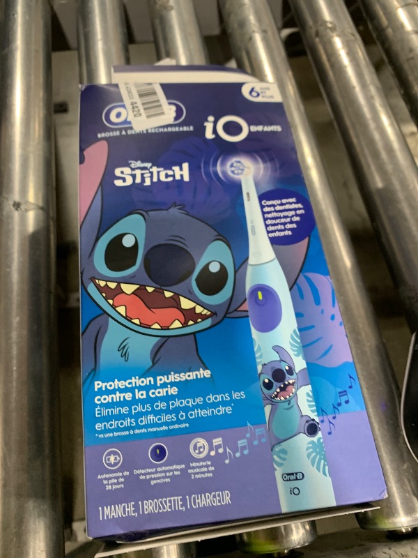 Photo 1 of Oral-B iO Kids Rechargeable Electric Toothbrush, Stitch with 1 Brush Head - Automatic Pressure Sensor - 3 Cleaning Settings - 2 Min Music Timer - 28 Day Battery Life