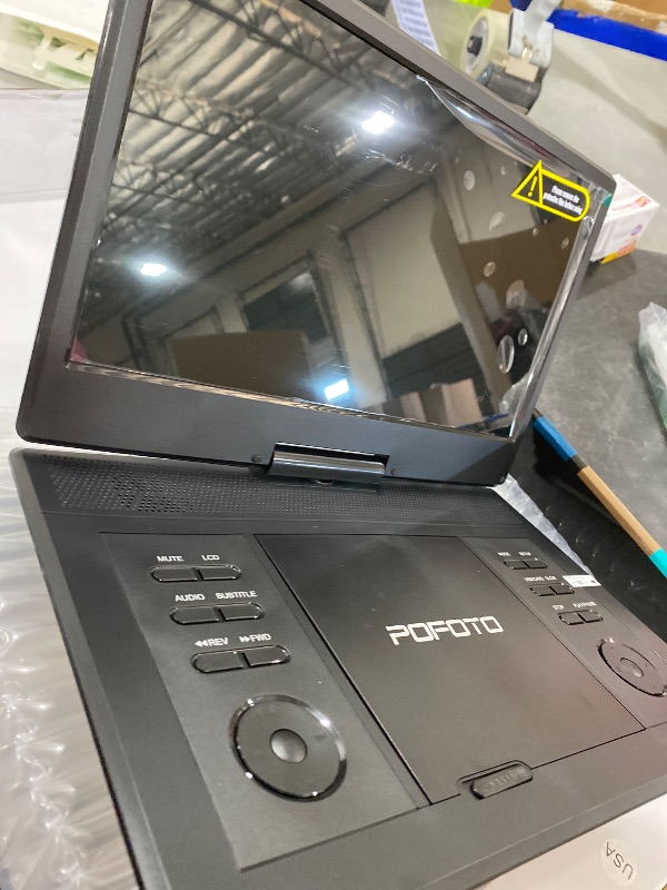 Photo 1 of POFOTO 15.7" Portable DVD Player with 14.1" HD Swivel Screen, 6-Hour Rechargeable Battery, Dual Speakers, USB/SD/TV Sync, Supports Multiple Disc Formats, Black [Not Support Blu-Ray]