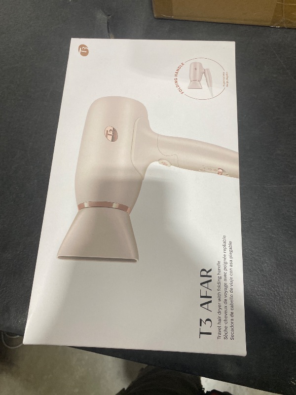 Photo 1 of T3 Afar Lightweight Travel-Size Hair Dryer with Auto Dual Voltage, Folding Handle, Fast Drying, Lightweight and Ergonomic, Frizz Smoothing, Multiple Heat and Speed Combinations