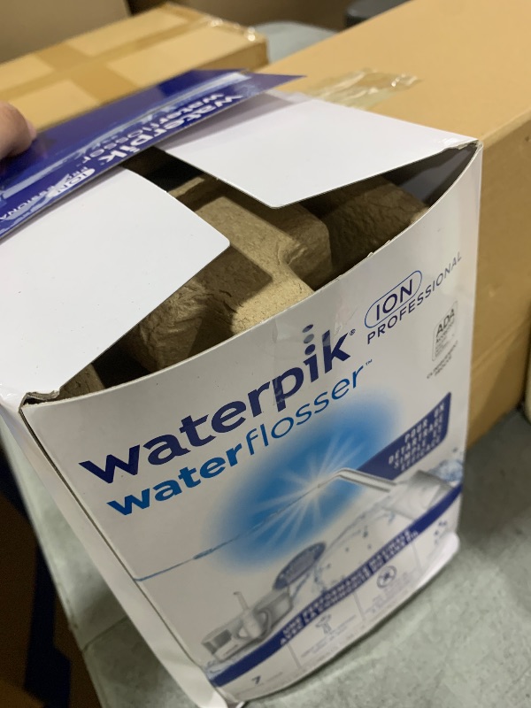 Photo 1 of Waterpik ION Professional Water Flosser, Rechargeable and Portable for Teeth, Gums, Braces, 10 Settings, 7 Flossing Tips For Multiple Users And Needs, ADA Accepted, WF-12 White, Packaging May Vary