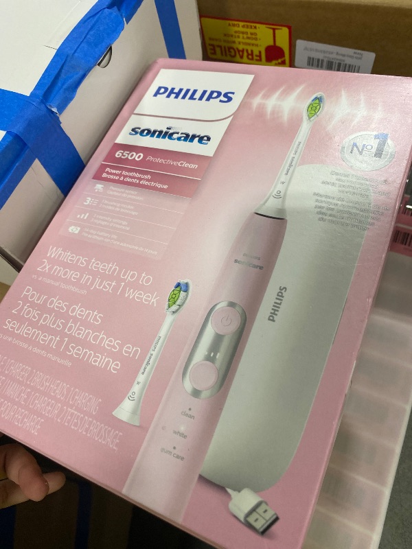 Photo 1 of Philips Sonicare ProtectiveClean 6500 Rechargeable Electric Toothbrush, with Pressure Sensor, 3 Cleaning Modes, SmarTimer and QuadPacer, 14-Day Battery Life, Charging Travel Case, Pink, HX6462/06