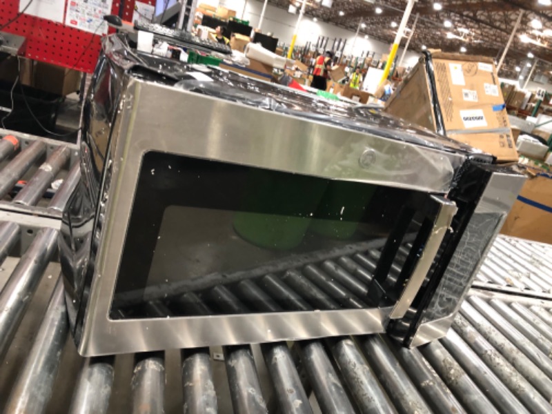 Photo 1 of *HEAVILY DAMAGED* GE 30" Over-the-Range Microwave, 1.6 Cu. Ft., 1000 Watts, 300 CFM Hood Vent, LED Lighting, Auto Defrost, Easy Mount Install, Stainless Steel, JVM3160RFSS