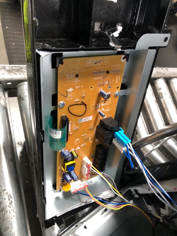 Photo 1 of *HEAVILY DAMAGED* GE 30" Over-the-Range Microwave, 1.6 Cu. Ft., 1000 Watts, 300 CFM Hood Vent, LED Lighting, Auto Defrost, Easy Mount Install, Stainless Steel, JVM3160RFSS