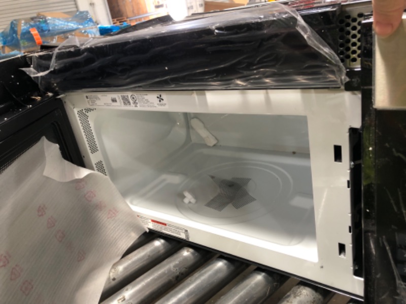 Photo 1 of *HEAVILY DAMAGED* GE 30" Over-the-Range Microwave, 1.6 Cu. Ft., 1000 Watts, 300 CFM Hood Vent, LED Lighting, Auto Defrost, Easy Mount Install, Stainless Steel, JVM3160RFSS