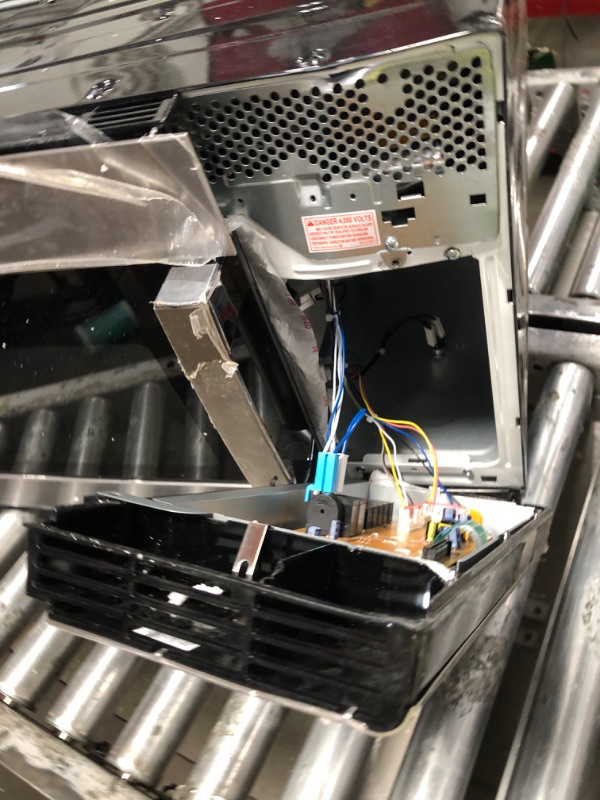 Photo 1 of *HEAVILY DAMAGED* GE 30" Over-the-Range Microwave, 1.6 Cu. Ft., 1000 Watts, 300 CFM Hood Vent, LED Lighting, Auto Defrost, Easy Mount Install, Stainless Steel, JVM3160RFSS