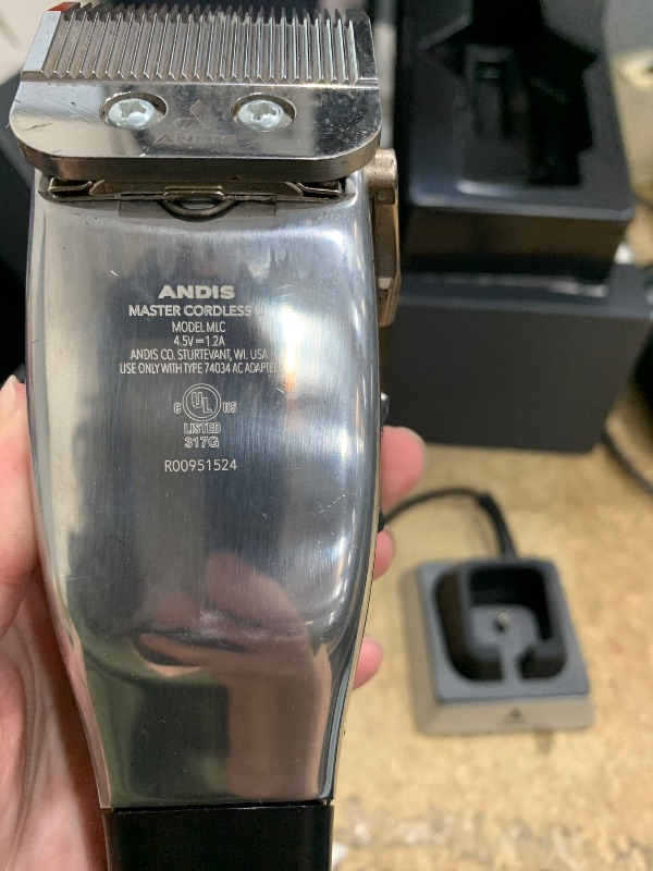 Photo 1 of Andis 12660 Professional Master Corded/Cordless Hair Clipper, Adjustable Carbon Steel Blade Hair Clipper for Close Cutting, Silver