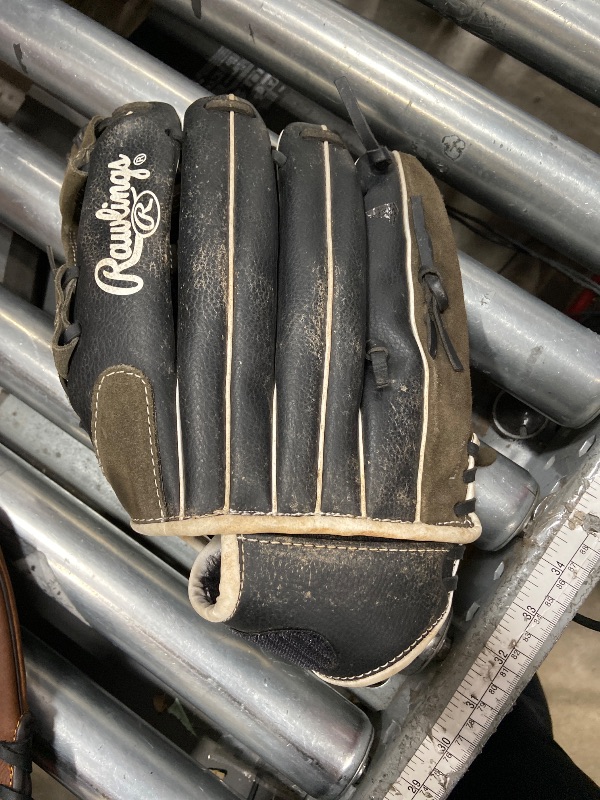 Photo 1 of **DIRTY**Rawlings baseball glove